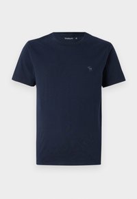 T-shirt in cotone blu navy con scollo a giro e maniche corte. Presenta un piccolo logo ricamato sul petto. Texture liscia.