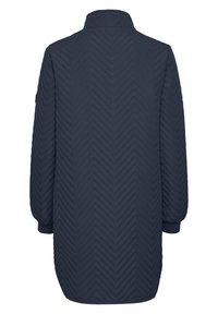 Marinen quiltet jakke med et chevron-mønster, der har en stående krave og elastiske manchetter. Mellemlang design med en glat tekstur.