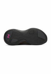 Black rubber shoe sole with textured surface and flex grooves, featuring purple logo accents and shaped traction pods.
