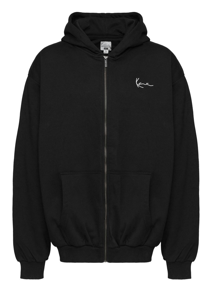 Fekete, cipzáros kapucnis pulóver, pamutból készült. Kanguruzsebbe, bordás passzéval ellátott ujjak, és egy kis fehér logó található a mellkason. Puha, laza fazonú.