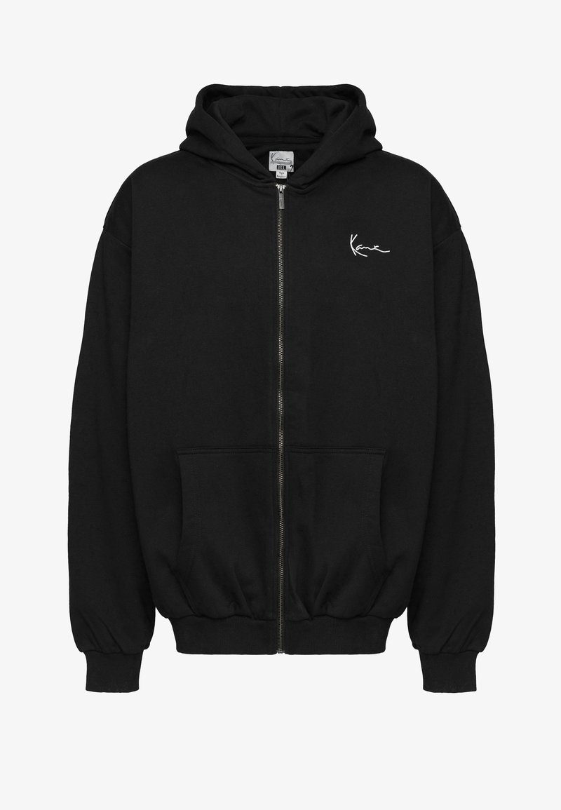 Fekete, cipzáros kapucnis pulóver, pamutból készült. Kanguruzsebbe, bordás passzéval ellátott ujjak, és egy kis fehér logó található a mellkason. Puha, laza fazonú.