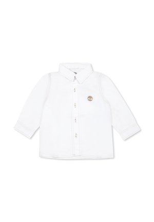 Camicia bianca in cotone a maniche lunghe con colletto, chiusura a bottoni e logo ricamato sul petto. Presenta cuciture e polsini a contrasto.