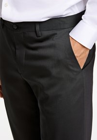 Lindbergh TECHNICAL STRETCH COMBI - Pantalon - black