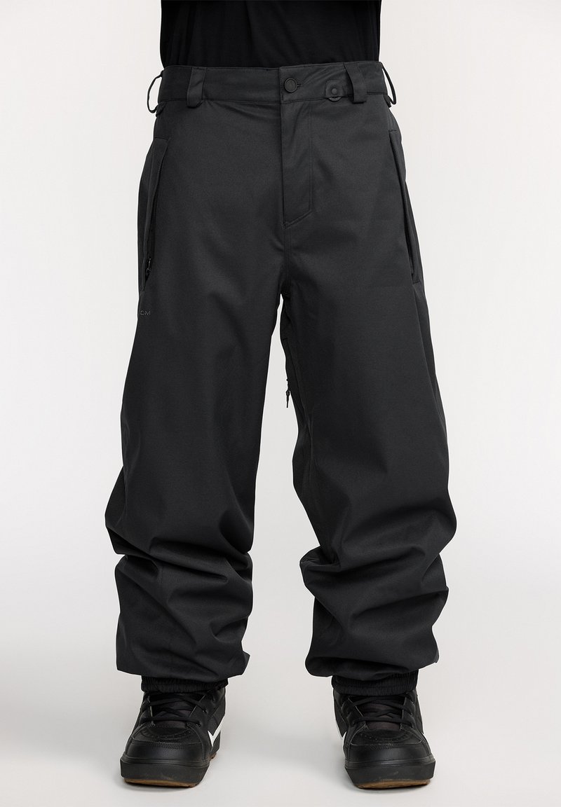Pantalones de nieve negros con un ajuste holgado, hechos de un tejido duradero. Cuentan con bolsillos con cremallera y puños elásticos en los tobillos.
