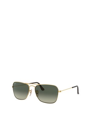 Occhiali da sole aviator color oro con lenti verdi sfumate. Montatura in metallo sottile e punte delle aste nere texturizzate. Naselli regolabili per una vestibilità ottimale.