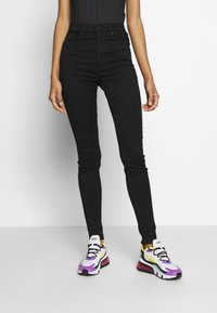 Monki Vaqueros pitillo - black