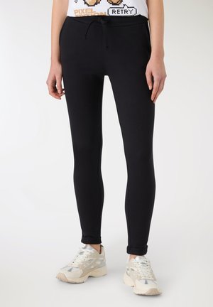 A UNITA - Pantaloni sportivi - nero