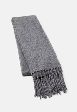 Écharpe en laine grise avec une texture douce, de forme rectangulaire et des bords frangés. Le tissu présente un motif de tissage subtil.