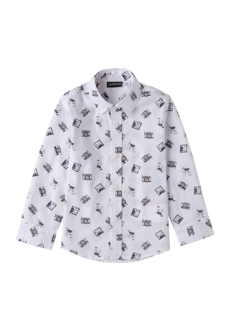 Camicia bianca con bottoni caratterizzata da un motivo di macchine fotografiche e cani in cartone animato. Maniche lunghe con polsini, realizzata in tessuto leggero.