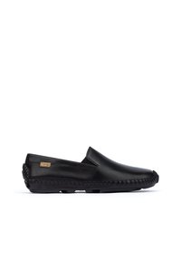 Black leather slip-on loafer with visible stitching around sole and side branding tag, displayed against white background.