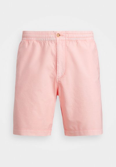 Šviesiai rožinės šortai, pagaminti iš minkštos medžiagos, su elastinga juosmens juosta, vieninteliu mygtuko užsegimu ir švariu apdailu be raštų.