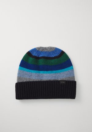 Multicolored knit beanie with stripes in blue, green, grey, and black. Features a ribbed navy cuff and a tag with brand logo.