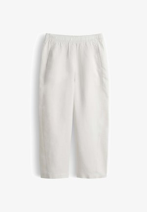 White elastic waist pants with a relaxed fit, two side pockets, and straight cropped legs.
