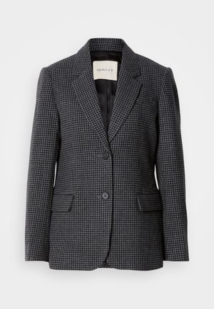 Pelēks un melns rūtainais žakete, strukturēts dizains, ar iegriezuma atloku, diviem pogu aizdari, kabatām ar plāksteri un gludu iekšējo oderi.