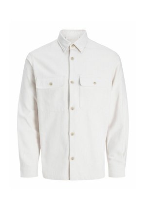 Camisa de botones de color claro, hecha de una tela texturizada, que presenta dos bolsillos en el pecho, un cuello y cierre de botones en el frontal.