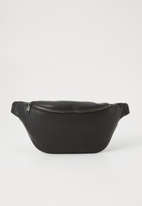 Borsa vita in pelle nera con chiusura a zip e logo "cK" impresso sul davanti, mostrata su uno sfondo bianco neutro.