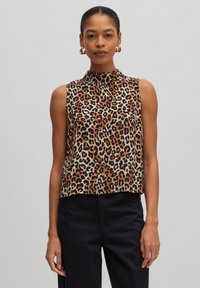 Ärmelloses Oberteil im Leopardenmuster mit hochgeschlossenem Kragen, in Braun-, Schwarz- und Beigetönen. Weicher Stoff mit lässigem Schnitt.