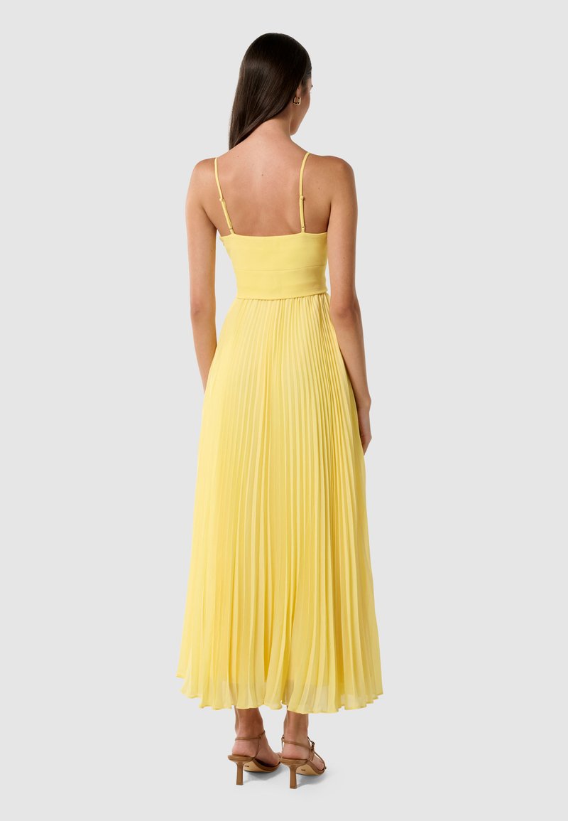 open lace back dress Stolen Stores Ms. Pleat Maxi Dress in Yellow Mustard