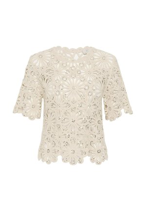Blusa corta de encaje crema con manga corta, patrón floral recortado y pequeños adornos de lentejuelas, borde festoneado en el dobladillo y las mangas.