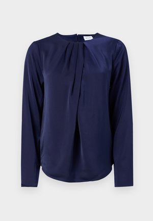 Tumedat sinise pikka varrukaga pluus ümmarguse kaelusega ja esise plekitusega, valmistatud siledast, läikivast kangast.