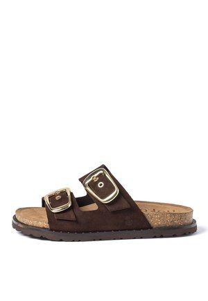 Brown suede slide sandal with two adjustable gold-tone buckles and cork footbed on a black rubber sole.