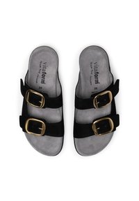 Black suede sandals with two adjustable straps and gold buckles. Soft gray insoles with printed logo. Size 39. Flat sole design.