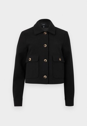 Black cropped jacket made of textured fabric, featuring a collar, four front pockets, and brown buttons for closure and detail accents.