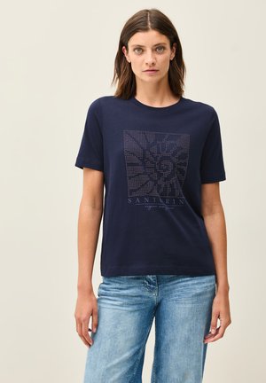 Navyblauw T-shirt met korte mouwen van katoen, voorzien van een bedrukte afbeelding met witte stippen en de tekst "Santorin" op de voorkant.