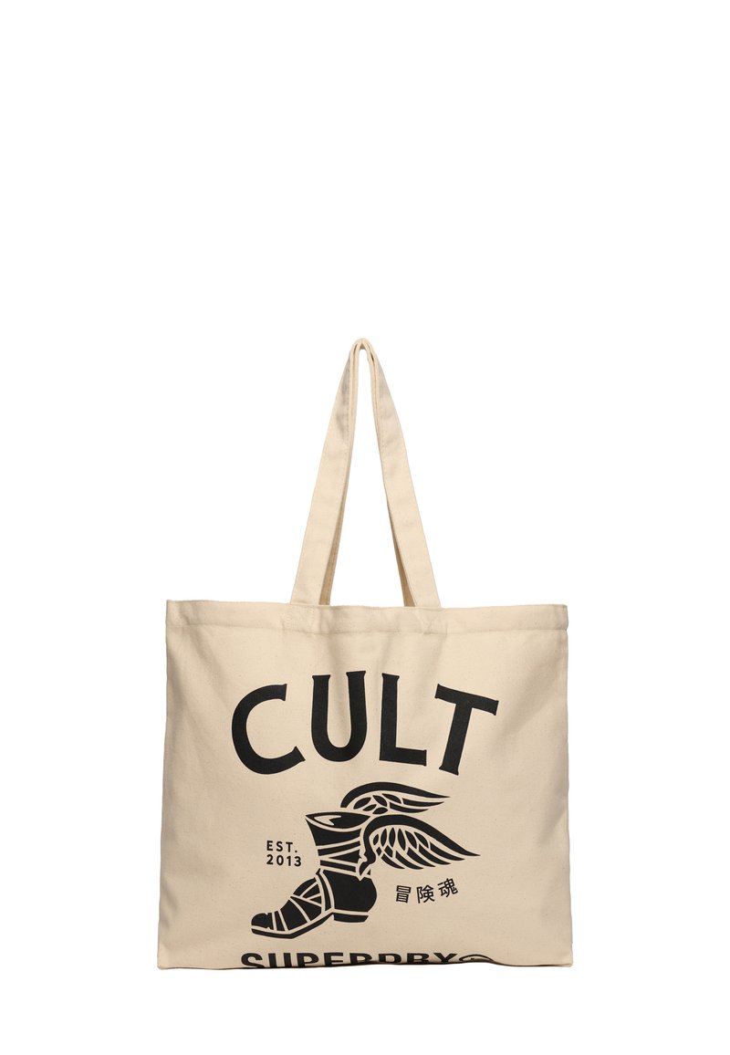 Beżowa torba płócienna z wyraźnym czarnym napisem "CULT" oraz grafiką skrzydlatej buty. Solidny materiał i długie rączki do łatwego noszenia.