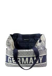 Canvas draagtas met marineblauwe accenten, voorzien van een grafisch ontwerp van bezienswaardigheden en de tekst "DUITSLAND", een ritsvak aan de binnenkant en dubbele handgrepen.
