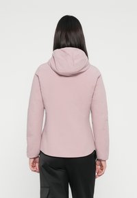 Light pink insulated jacket with a hood, featuring a smooth texture and fitted silhouette. Back view shows no distinctive patterns or accents.