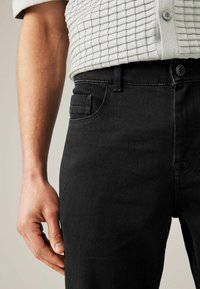 Next SUMMERWEIGHT COTTON - Jeans Tapered Fit - black