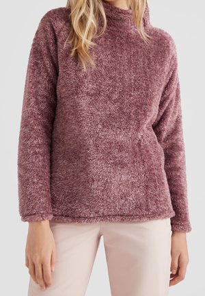 Vozige, licht mauve trui met een hoge kraag en lange mouwen. Zachte textuur en relaxed fitting zorgen voor warmte en comfort.