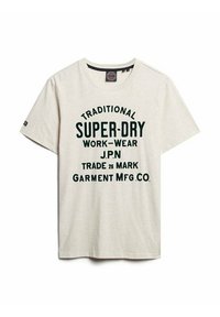 Light beige cotton t-shirt with short sleeves, featuring green bold text: "TRADITIONAL SUPER-DRY WORK-WEAR J.P.N TRADE 26 MARK GARMENT MFG. CO."
