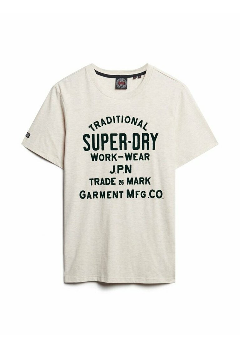 Light beige cotton t-shirt with short sleeves, featuring green bold text: "TRADITIONAL SUPER-DRY WORK-WEAR J.P.N TRADE 26 MARK GARMENT MFG. CO."