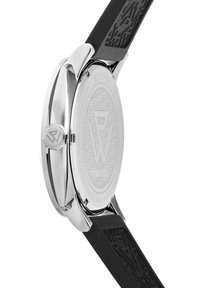 Silver stainless steel watch case with a black silicone strap. Notable engraved patterns on the case back and textured strap surface.