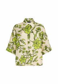 Chemise à boutons avec manches courtes larges, fond beige et imprimé floral vert vif avec contours noirs.