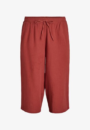 Punased, tekstuuriga põlvpüksid, millel on elastne vöökoht ja reguleeritav nöör. Valmistatud kergetest kangast. Taskud ei ole nähtavad.