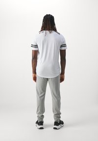 Champion ICON PANTS - Tepláky - grey