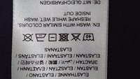 Washing instructions with symbols: no bleach, machine wash cold, do not tumble dry, do not dry clean, iron low heat. Reshape while wet.