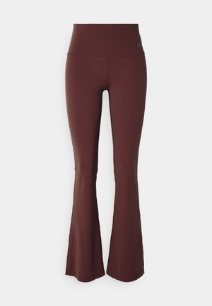 Maroon flared leggings with a high waistband and smooth, stretchy fabric. Features a small blue logo on the upper left side.