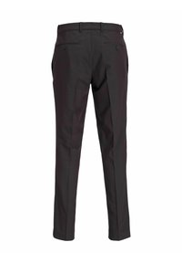 Pantalones negros ajustados con una tela suave, piernas acampanadas y dos bolsillos traseros con cierres a botones.