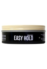 Sort, rundt blik med en mat finish, der har et cremefarvet låg. Teksten viser "EASY HOLD" tydeligt i hvidt. Minimalistisk design uden mønstre.