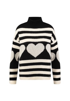 Suéter a rayas blanco y negro con cuello alto, que presenta grandes patrones de corazones en el centro y en las mangas. Textura suave y corte holgado.
