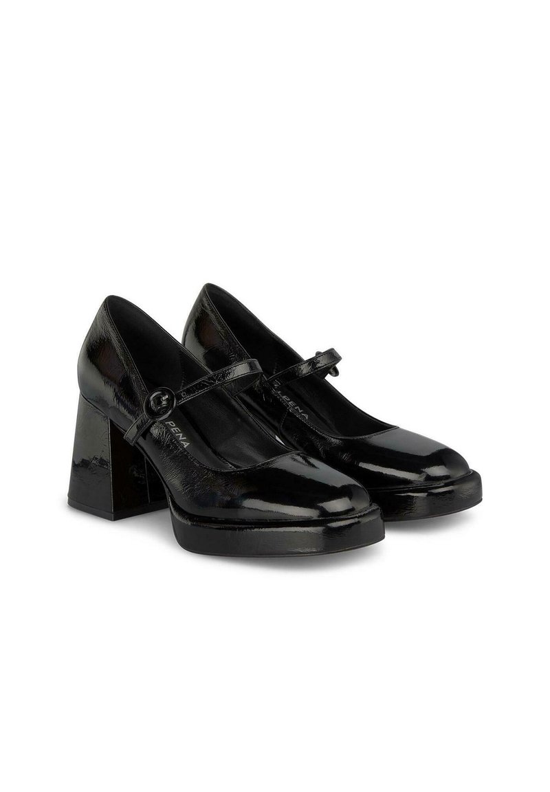Zapatos de charol negros tipo Mary Jane con punta redonda, plataforma plana y tacón cuadrado grueso. Cuenta con una correa con una hebilla circular.