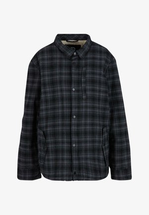 Giacca a camicia a quadri nera, grigia e bianca; presenta un colletto, tasche laterali e un interno morbido e foderato per il calore.
