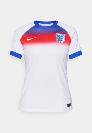 White sports jersey with a gradient design transitioning from red to blue at the shoulders. Features blue accents on the cuffs and a crest.