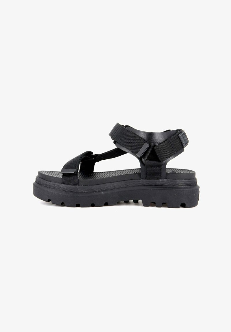 Black open-toe sandal with thick sole, adjustable ankle and toe straps, and rugged tread for outdoor wear.