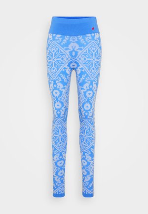 Blå leggings med en kontrasterande blå midjeresår, prydda med ett blommigt och geometriskt mönster i ljusblå toner.