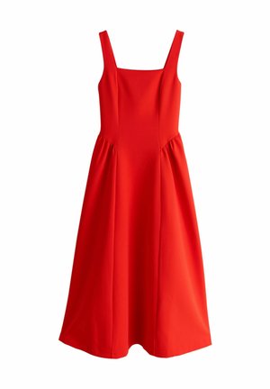 Punainen mekko, jossa on neliömäinen pääntie, leveät olkaimet ja laskostettu sivusomistus. Valmistettu sileästä kankaasta, polvenpituinen ja liehuva malli.
